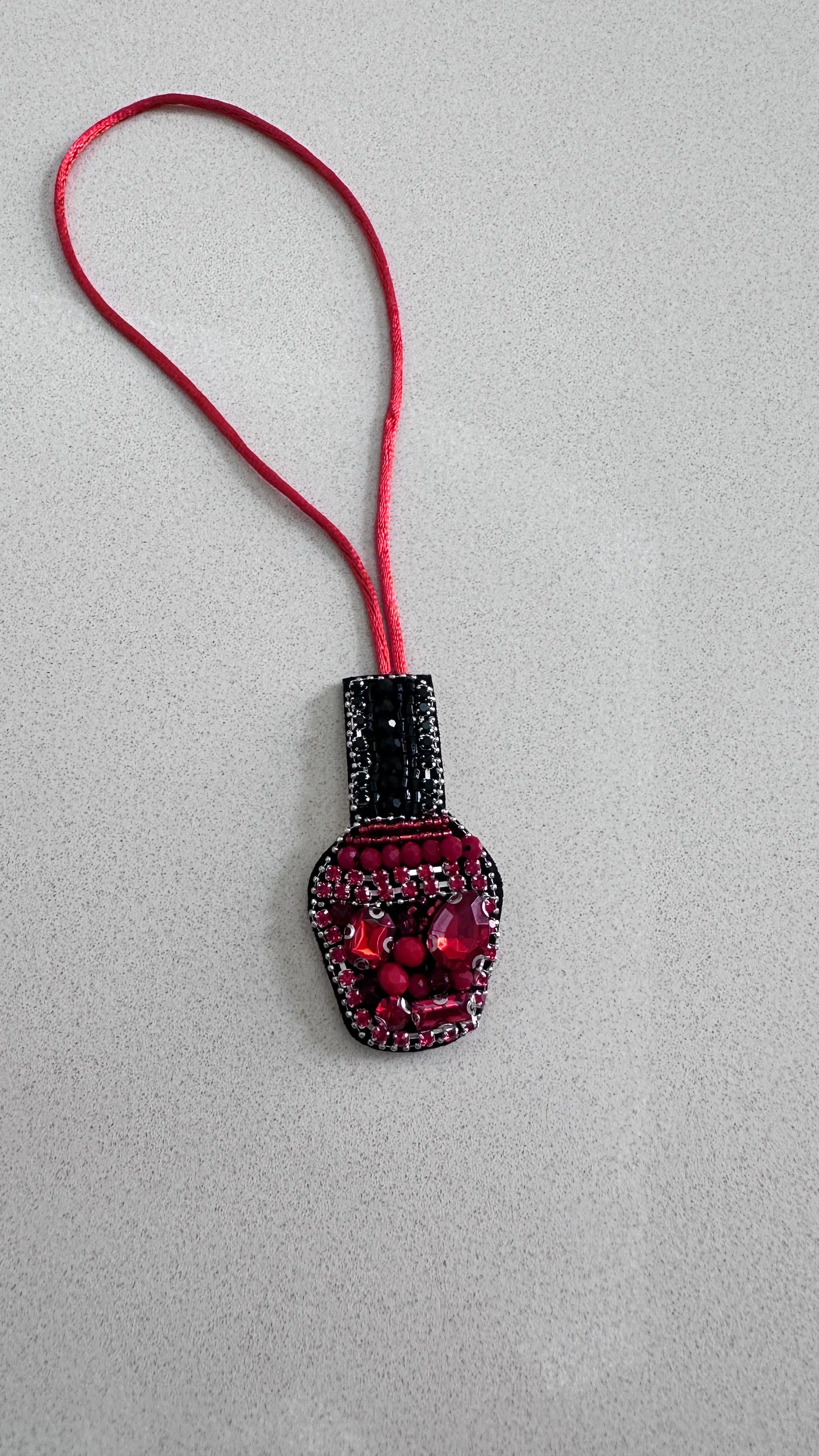 Nail polish charm